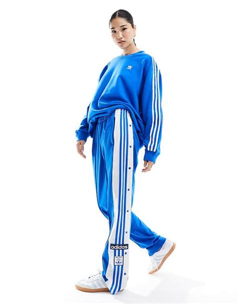 adidas bukser med knapper i siden
